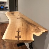 Breakfast Bar -- solid butternut natural edge slab, walnut bowtie accents, custom ironwork