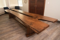Conference Table -- solid butternut, double natural edge slab top, curved tree base design, 4' x 14'